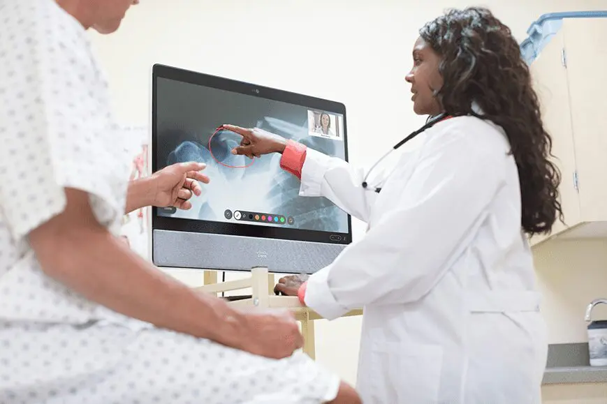 Doctor and patient viewing an x-ray - healthcare webex image