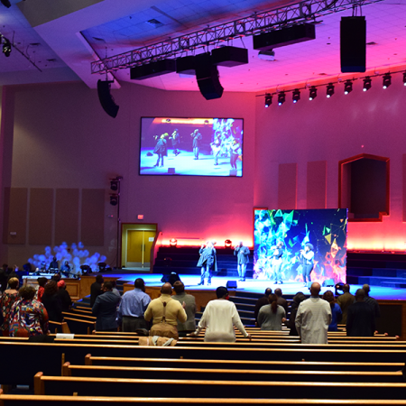 Image of a church with MCC audio visual solutions installed including lighting and sound systems, projectors and screens and video production.